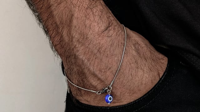 Wire bracelet with blue eye